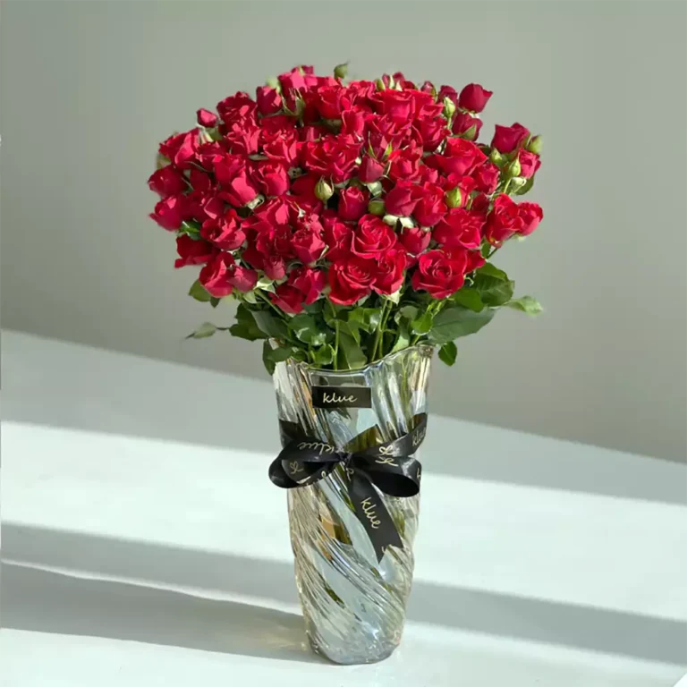 Red baby roses vase